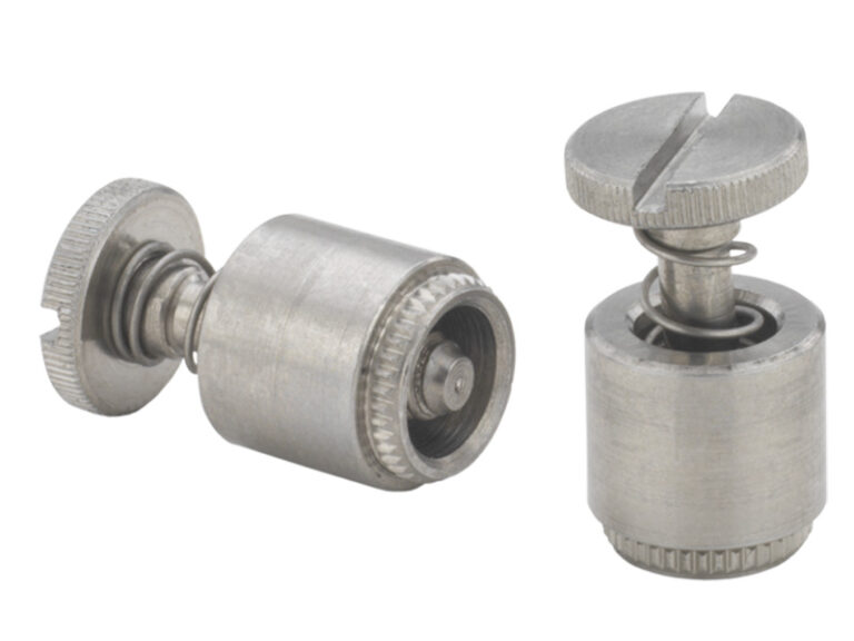 Spring loaded screw in a broaching retainer